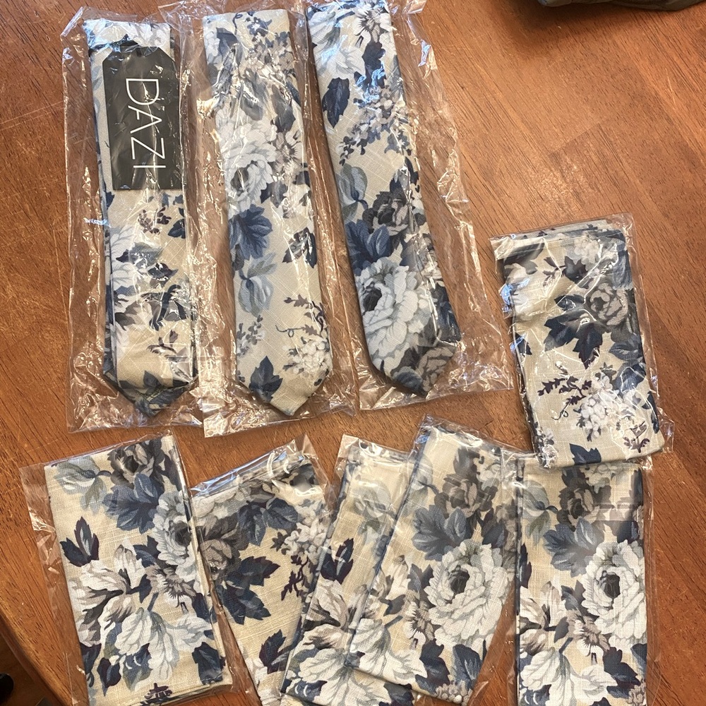 3 ties and 5 matching pocket squares never opened, with tags.